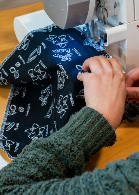 One of our team members sewing pasta print Paperless Towels
